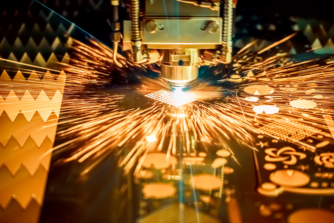 Laser cutting operation with sparks during sheet metal fabrication