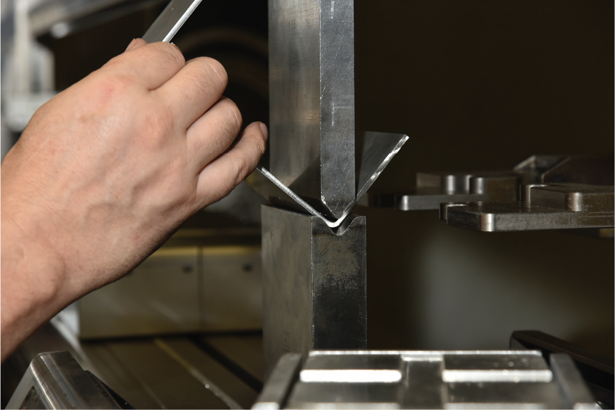 Hand assembling a sheet metal enclosure