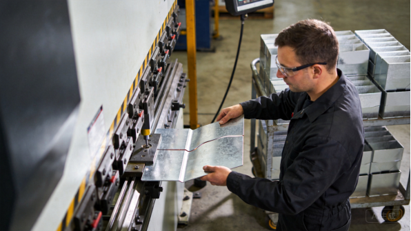 Technician working on a control panel assembly