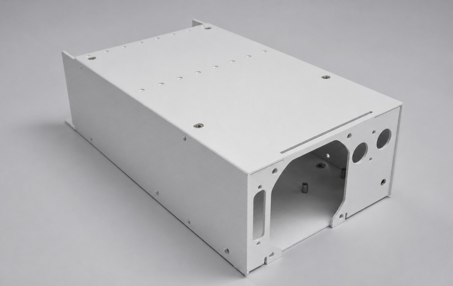 White powder-coated enclosure with cable cut-outs