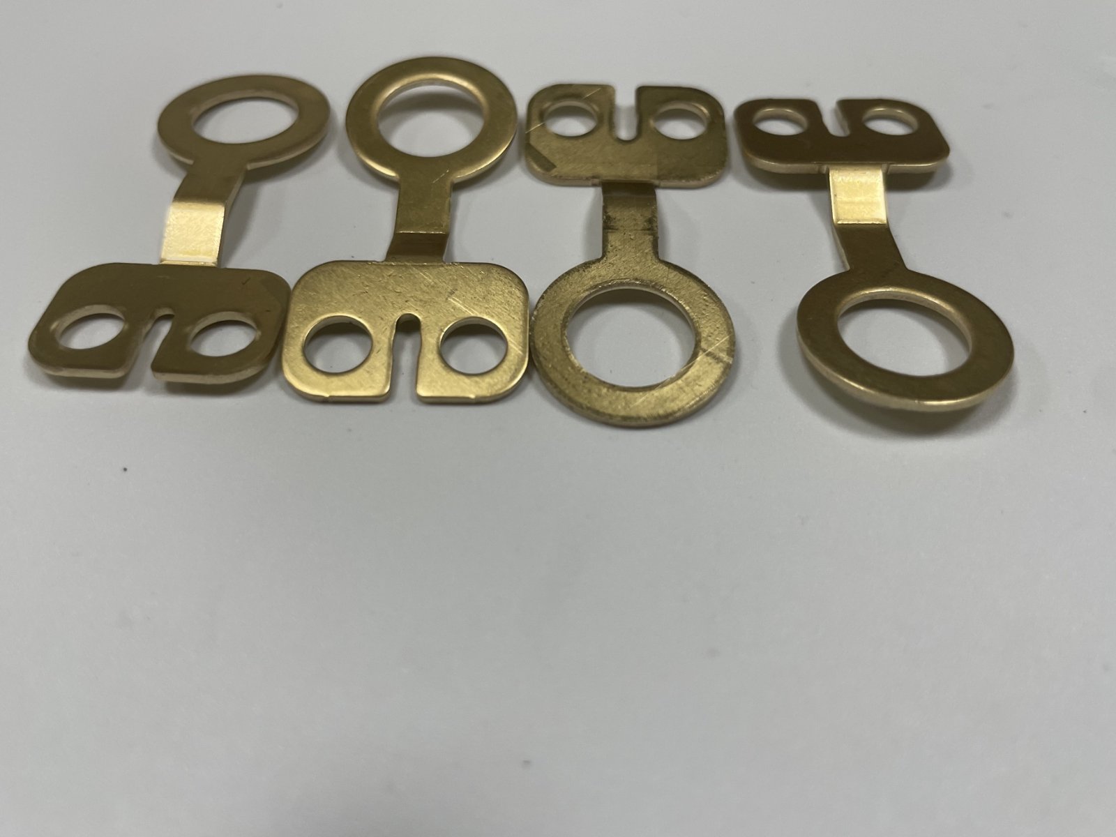 brass battery lugs - Straight and stepped necks produced from the same drawing family.