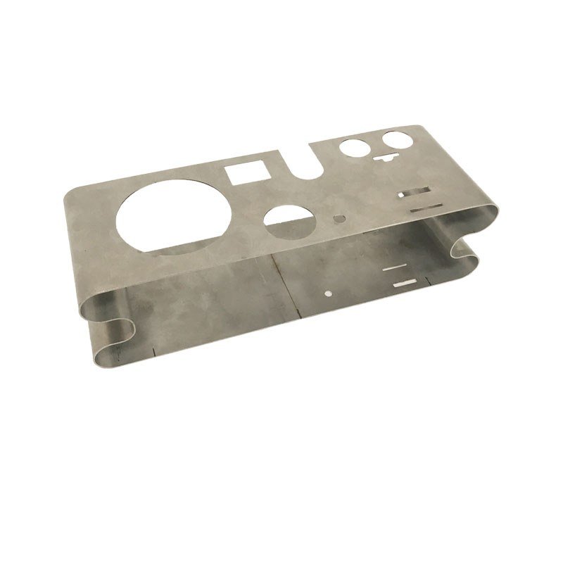 sheet metal capabilities - A stainless steel mounting bracket with laser-cut apertures, rolled edges and a set of pierced slots, formed without a dedicated die.