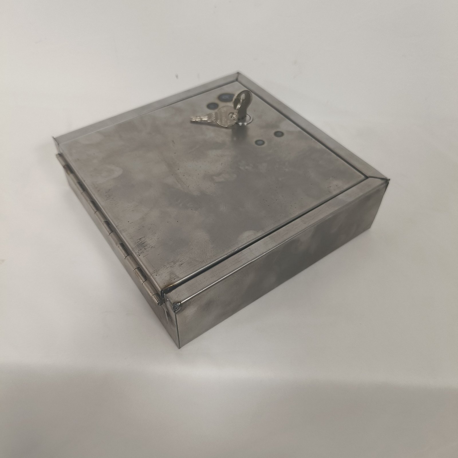 stainless steel letterbox - The folded and welded body of a stainless steel letterbox, seen from three quarters.