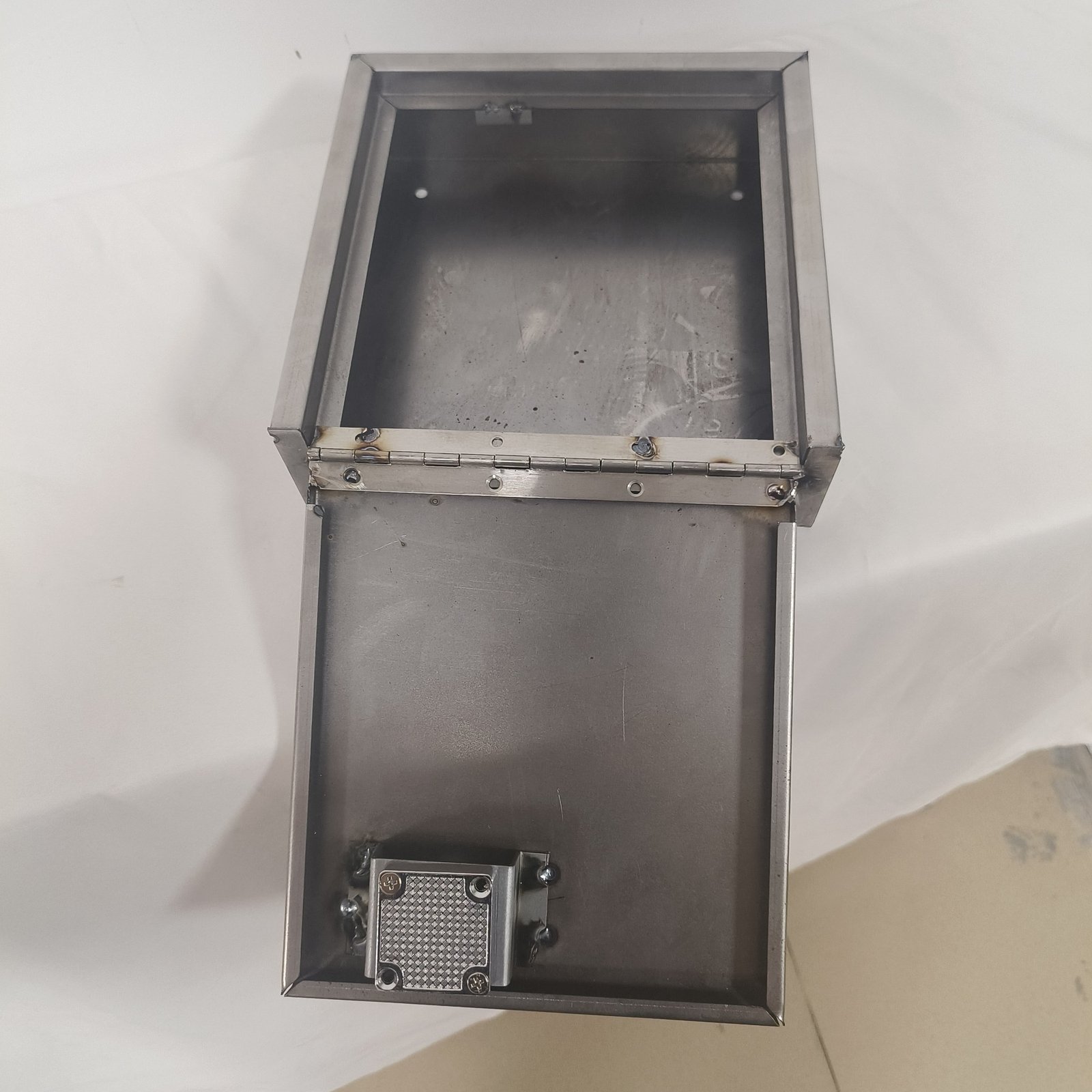 stainless steel letterbox - A production letterbox being opened and checked before packing.