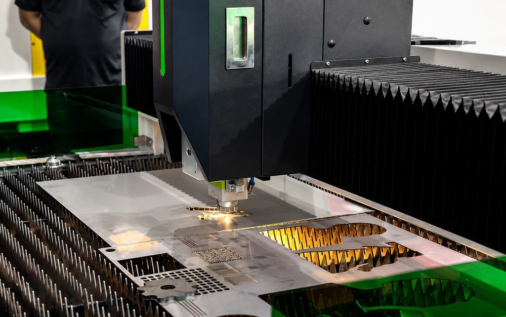 Laser cutting machine cutting a sheet metal plate