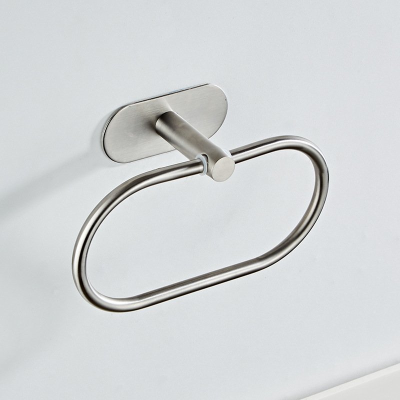 bathroom hardware - A paper holder in brushed stainless, showing the folded arm and the mounting flange.