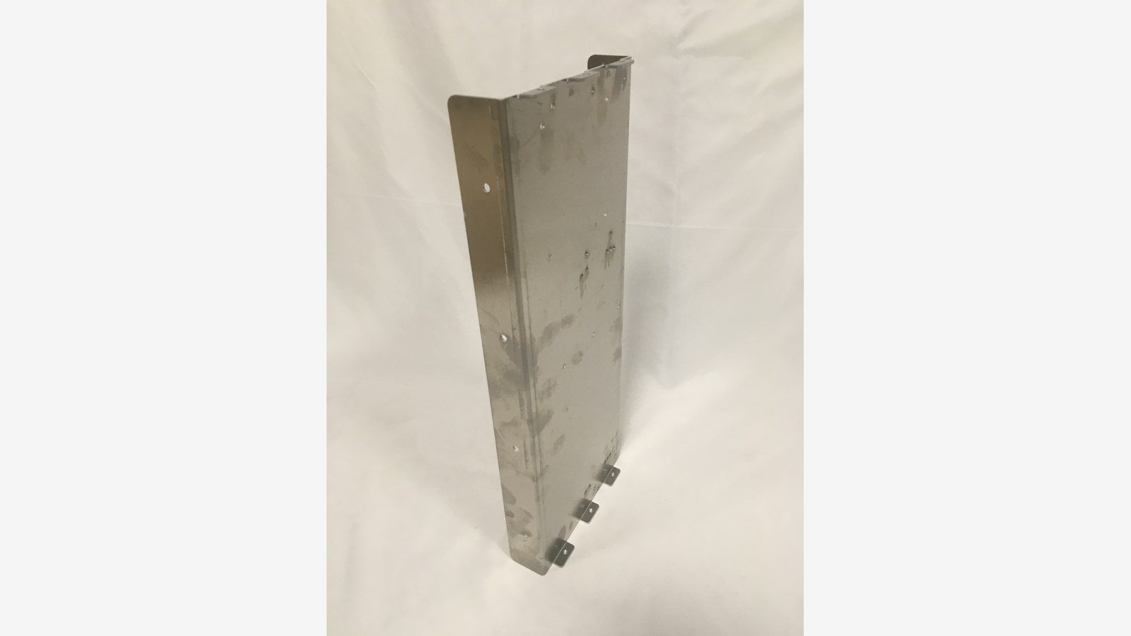 cnc punching service - A punched and formed stainless steel bracket with a regular hole pattern and formed tabs.