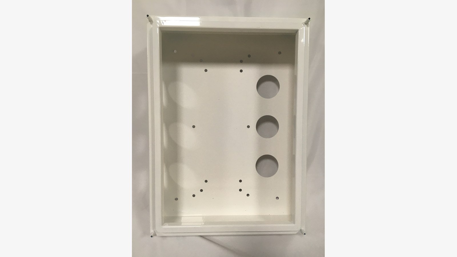 electronic metal housing - Interior of an electronic housing showing the gasket channel and internal mounting points.